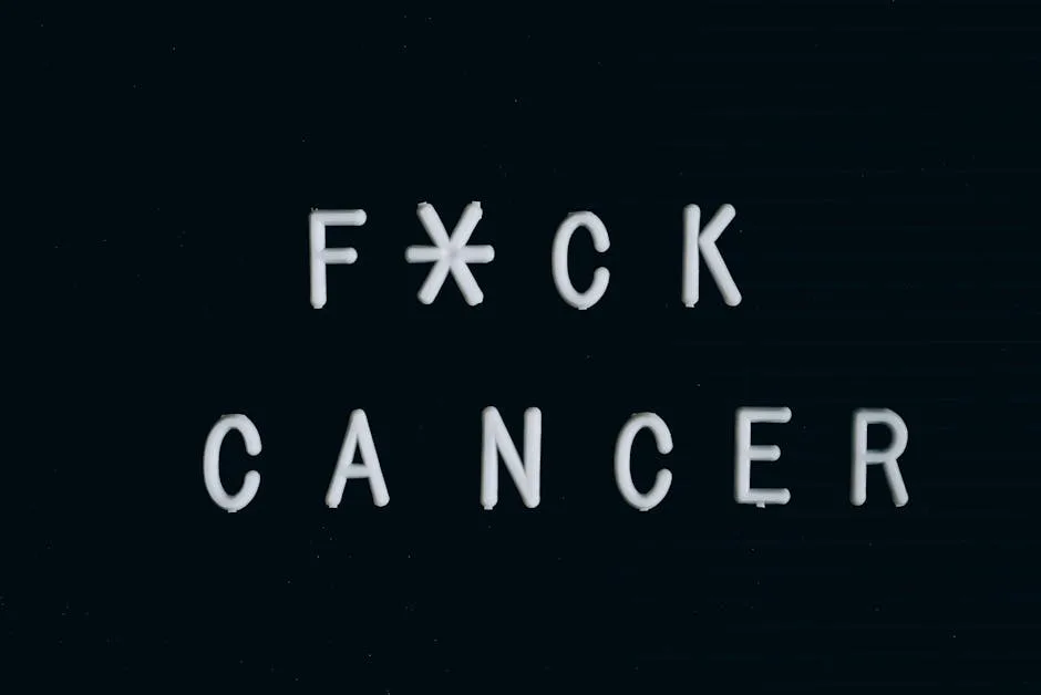 Motivational anti-cancer message on a letter board, emphasizing awareness.
